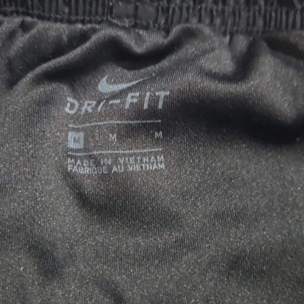 Nike Dri-Fit black lined women's shorts draw-string size medium